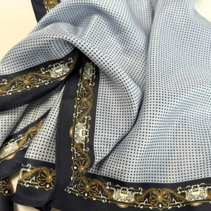 Close-up detail of women's vintage baroque style printed silk neck scarf with soft fabric.