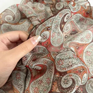 Elegant paisley print silk scarf featuring vibrant color block design for women fashion styling.