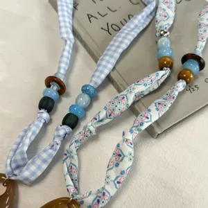 Fabric ribbon beaded necklace scarf chic neck accessory floral and checkered design detail