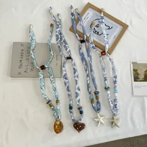 Fabric ribbon necklace set with vintage floral print and resin pendants for women fashion.