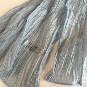 Light blue pleated mesh scarf, long narrow neckerchief, soft chiffon fashion accessory.