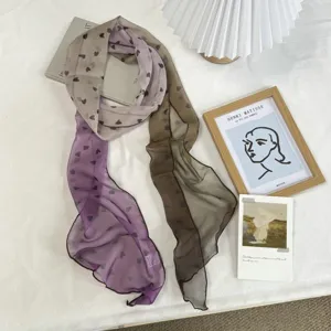 Gradient heart print long scarf made from soft polyester material, perfect for stylish wear.