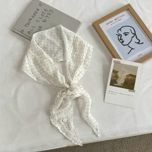 Detailed view of the Korean style polka dot long skinny scarf featuring an elegant flower knot.
