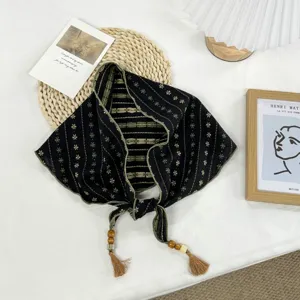 Retro artistic triangular headscarf with floral print, beaded tassels, elegant neckerchief.