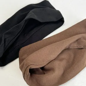 Detailed close-up showing the soft knitted texture and solid color fabric of the sleeves.