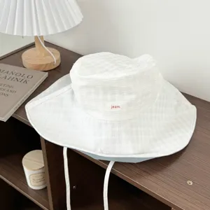 White wide brim bucket hat for women, sun protection sunhat with ties for summer outdoor daily wear.