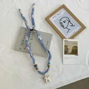 Chic summer blue fabric ribbon necklace featuring cute beads and starfish pendant for women.