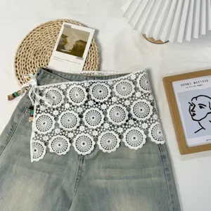 Layered lace denim skirt extension with bead tie detail, unique asymmetrical fashion piece.