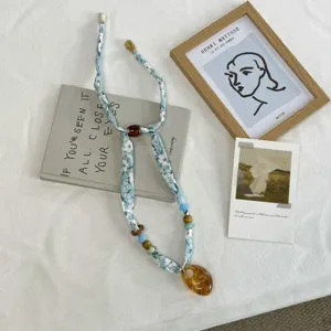 Floral fabric ribbon necklace with beads and amber resin pendant, chic spring summer shirt accessory