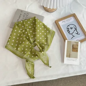 French vintage green polka dot cotton scarf detail showcasing elegant print and fine texture.
