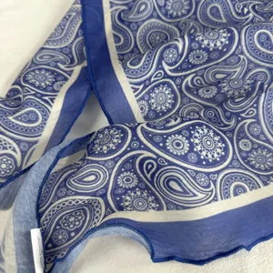 Blue paisley pattern scarf fabric detail close-up showcasing soft lightweight material texture
