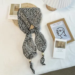 Chic floral ribbon scarf with delicate beads, versatile summer neck accessory for women.