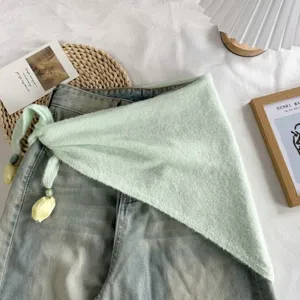 Green knitted triangular scarf shawl with cute tulip pendant tie, trendy aesthetic accessory.