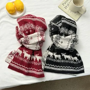 Cozy winter knit scarf featuring festive reindeer and snowflake patterns, warm and stylish.