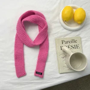 Bright pink knit winter scarf, narrow long design, cozy neck warmer, stylish daily wear.