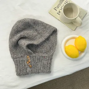 Grey speckled knit alpaca blend balaclava hooded scarf with horn buttons for winter warmth.