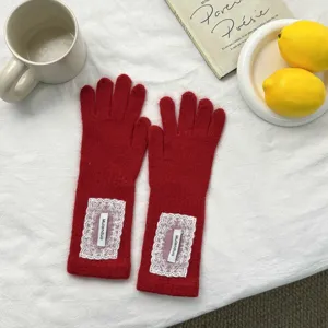 Red knitted long gloves with white lace patches, cozy autumn and winter warm finger gloves.