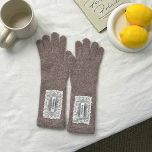Detailed view of Korean style lace knitted long finger gloves, warm autumn winter accessory.
