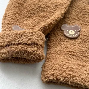 Brown fluffy fleece winter gloves with cute bear patch, thick warm thermal gear for outdoor sports.