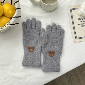 Cute grey fuzzy plush winter gloves with cute bear patch, thick warm split-finger detail shot.