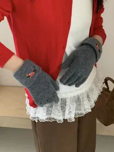 Cute puppy touchscreen knit five-finger gloves detail view, soft warm winter accessories.