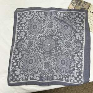 Detail view of a retro paisley printed cotton linen square scarf, soft and lightweight neckerchief.