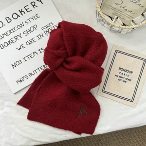 Cozy winter red knitted scarf, soft warm unisex winter scarf with delicate embroidery detail.