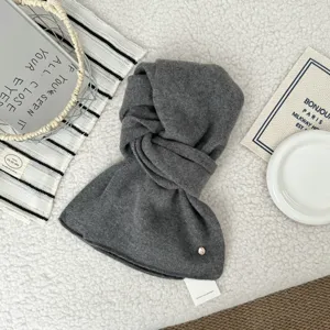 Dark gray wool knit scarf detail, thick warm winter neckerchief, cozy soft texture for women.