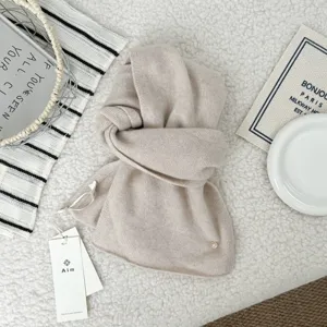 Cozy beige knit scarf for women, warm winter neck warmer, soft cashmere feel daily wear.