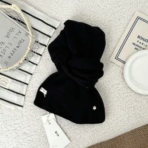 Black pure wool knitted scarf, winter thick warm neckerchief accessory detail view.
