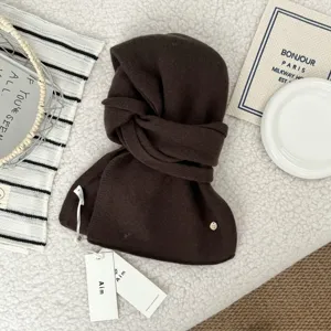 Dark brown knitted hooded scarf thick warm winter neck warmer detailed texture view.