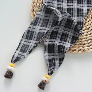 Retro black and white plaid triangular scarf with bead tassels, multi-functional waist tie accessory.