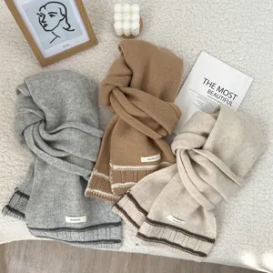 Cozy 100% wool winter scarf featuring elegant stripes and soft knit texture for cold days.