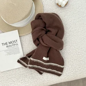 Brown knitted wool scarf with striped hem detail, cozy winter neck warmer for cold weather.