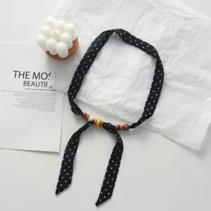 Black polka dot fabric scarf necklace with natural wooden beads, chic aesthetic choker chain.