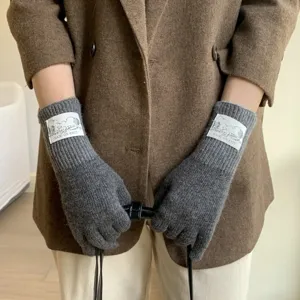 Winter wool blend knit gloves for women, dark grey split finger design with wrist label.