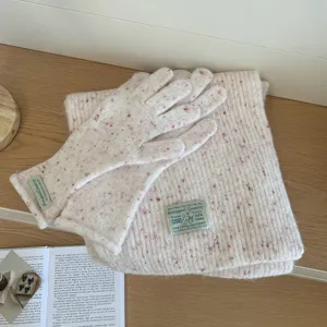 Cozy speckled knit scarf and gloves detail shot, soft warm winter accessory set for women.