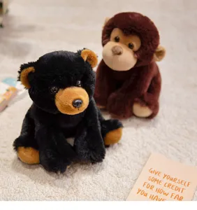 Cute plush toy detail shot showing soft stuffed black bear and brown monkey on cozy rug.