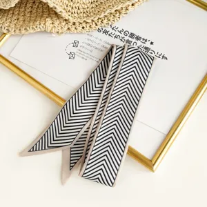 Black and white chevron narrow twilly scarf for stylish bag ribbon and neck accessories detail.