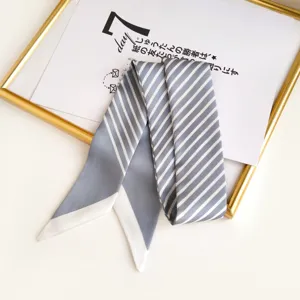 Grey white striped skinny twilly scarf detail, chic handbag ribbon and neck ribbon accessory.