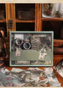 Vintage groene bladeren kantoorartikelen cadeaupakket met tapes stickers en notitieboeken.