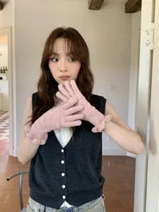 Pink knit gloves with cute ruffle cuffs, winter warm cozy knitwear detail display