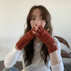 Winter warm knitted fingerless gloves for women, stylish solid color cute thermal hand warmers.