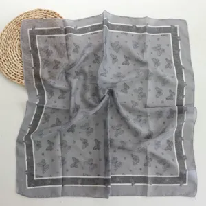 Grey cotton butterfly print square scarf 55cm detail showing color block border design.