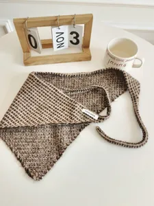 Brown knitted triangular scarf detail, stylish textured head wrap and waist tie accessory.
