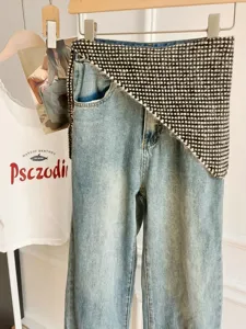 Blue denim jeans with black white knit waist wrap scarf stylish trendy streetwear outfit