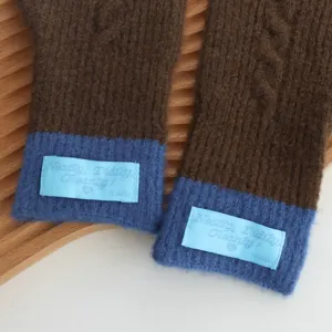 Cozy color-block knitted gloves for women, warm winter thermal touch screen design.