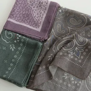 Detailed view of fashionable paisley square scarf set, lightweight fabric for women accessory.