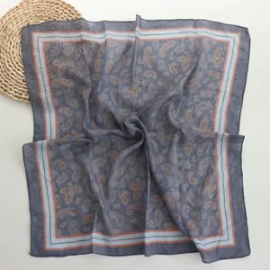 Detail view of the vintage cotton square scarf showcasing classic paisley pattern and borders.