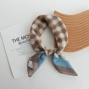 Detailed shot of cotton polka dot square scarf, featuring color block design and nice texture.